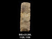 Three chipped stone shards, more or less square, placed one above the other, with parallel retouching on the edges. The number BiEx-23.206-1129-1150 is inscribed on the bottom.