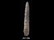 Two fragments of beige-ochre chipped stone forming a long linear point. The number BiEx-23.507-508 is inscribed on the bottom.
