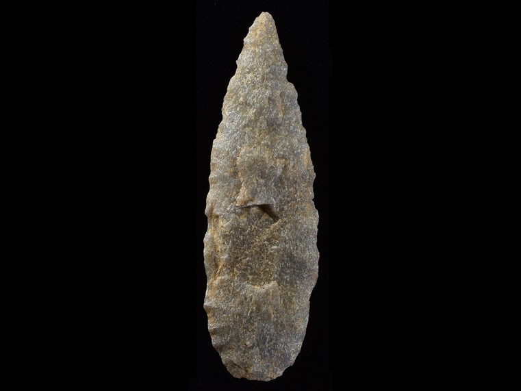 Grey, oval lance-shaped chipped stone.